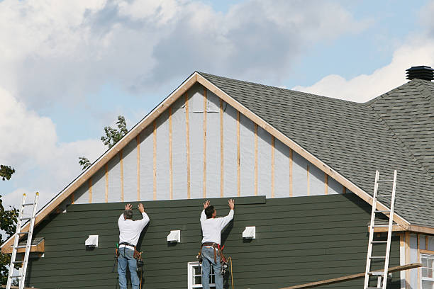 Professional Siding Contractor technician working in Paris, TN